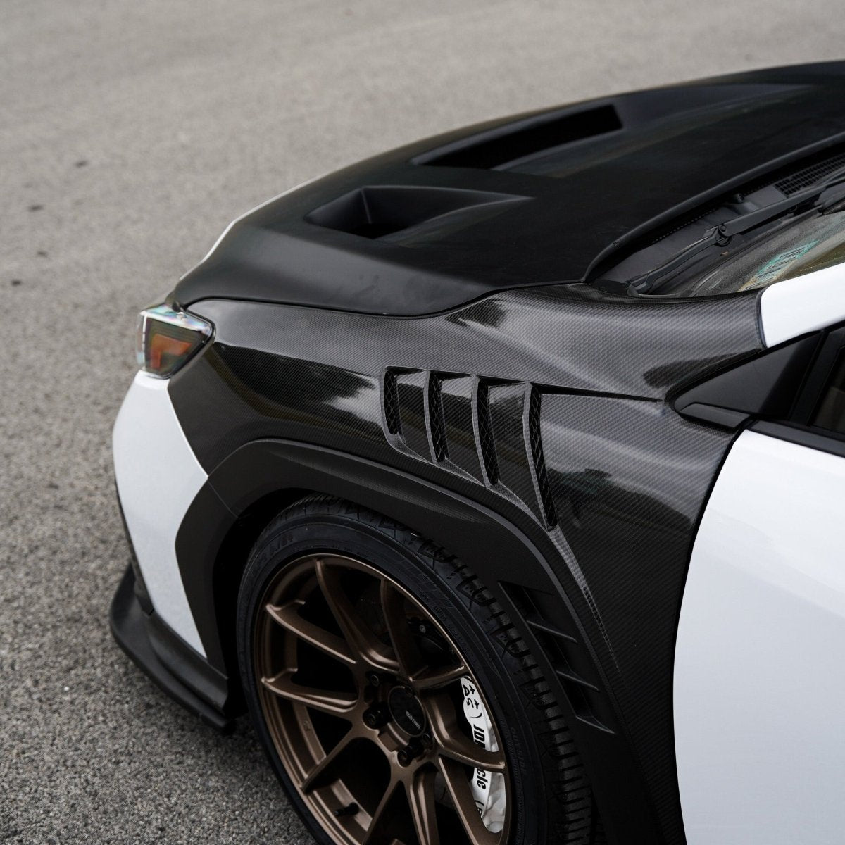 JDMuscle [22-25 WRX w/ FMIC] Carbon Fiber Scoopless Hood V1